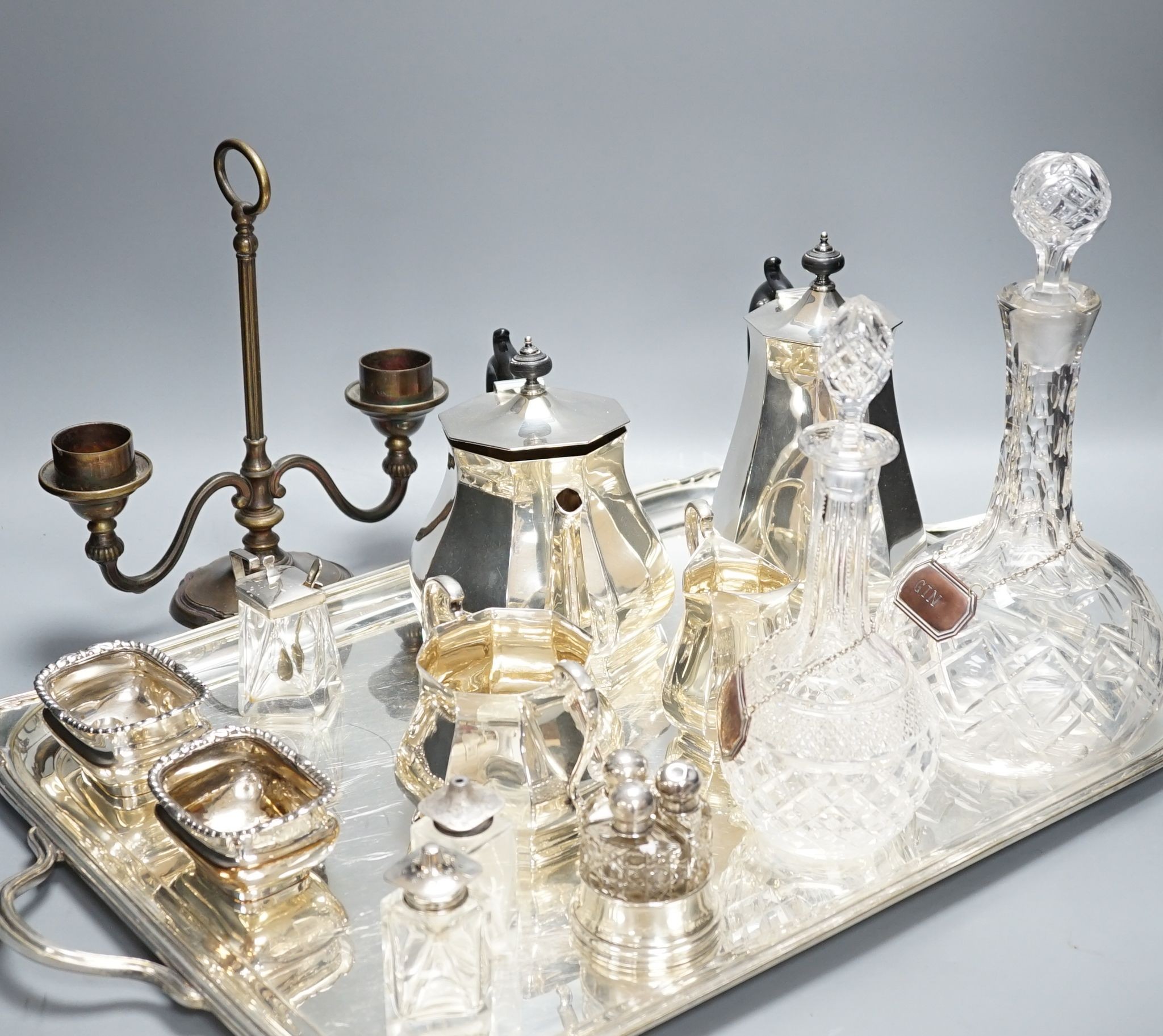 A quantity of silver plated tea/coffee wares including two handled tray, decanters, salts etc., 62cm